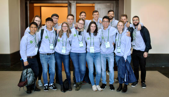 The Navarra BG iGEM team of young scientists pose in front of their scientific poster