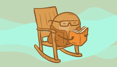 A cell with glasses and a coat reads while rocking on a rocking chair 
